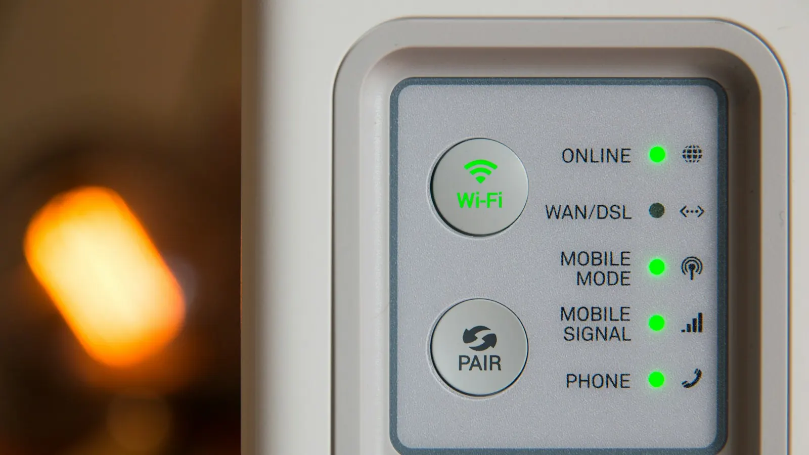 A Wi-Fi router with green status lights for online, Wi-Fi and signal